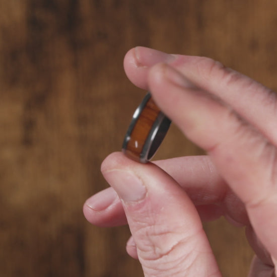 Trying on a Black Zirconium (charcoal gray color) with Desert Ironwood Men's Wedding Rings - Manly Bands