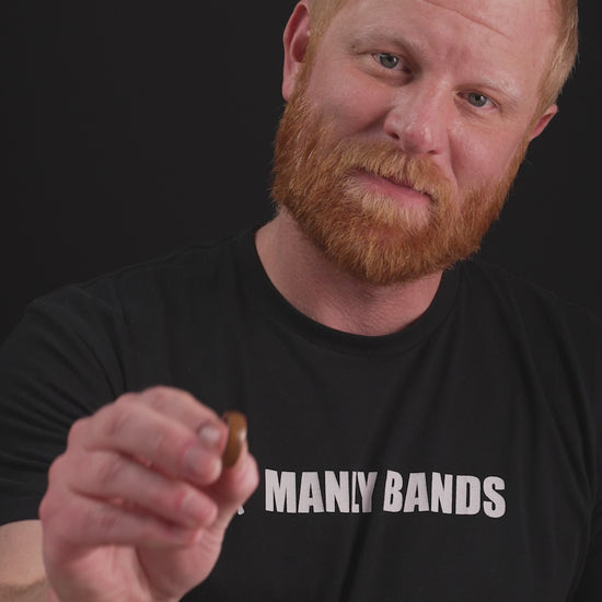 Trying on a men's wedding ring made of Rosewood and Guitar String- Fender - Manly Bands