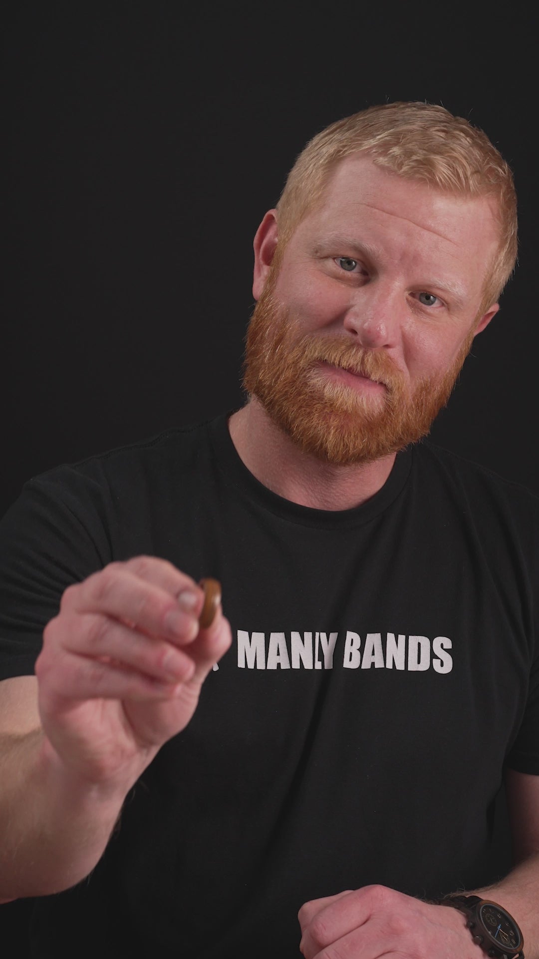 Trying on a men's wedding ring made of Rosewood and Guitar String- Fender - Manly Bands