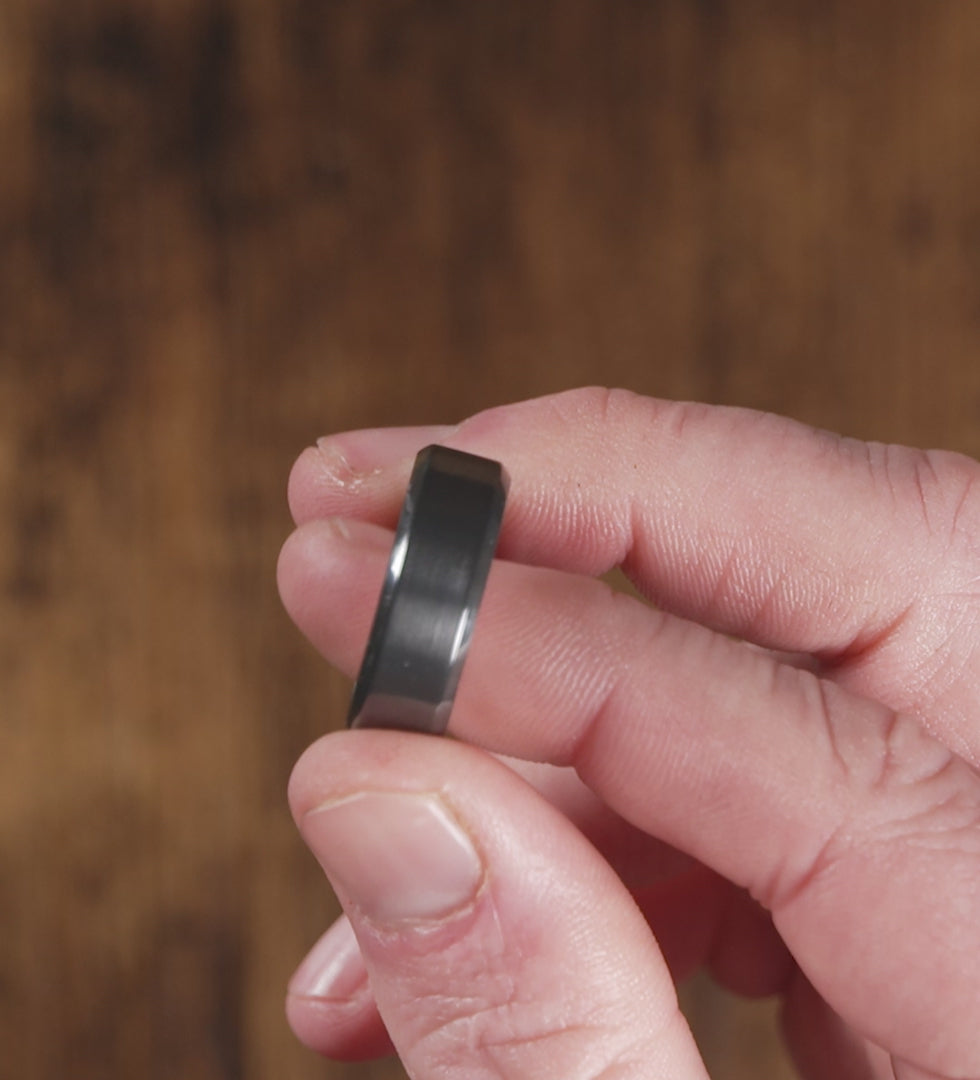 Trying on a men's wedding ring made of Black Zirconium (charcoal gray color) with Authentic Jack Daniel's Whiskey Barrel- Manly Bands